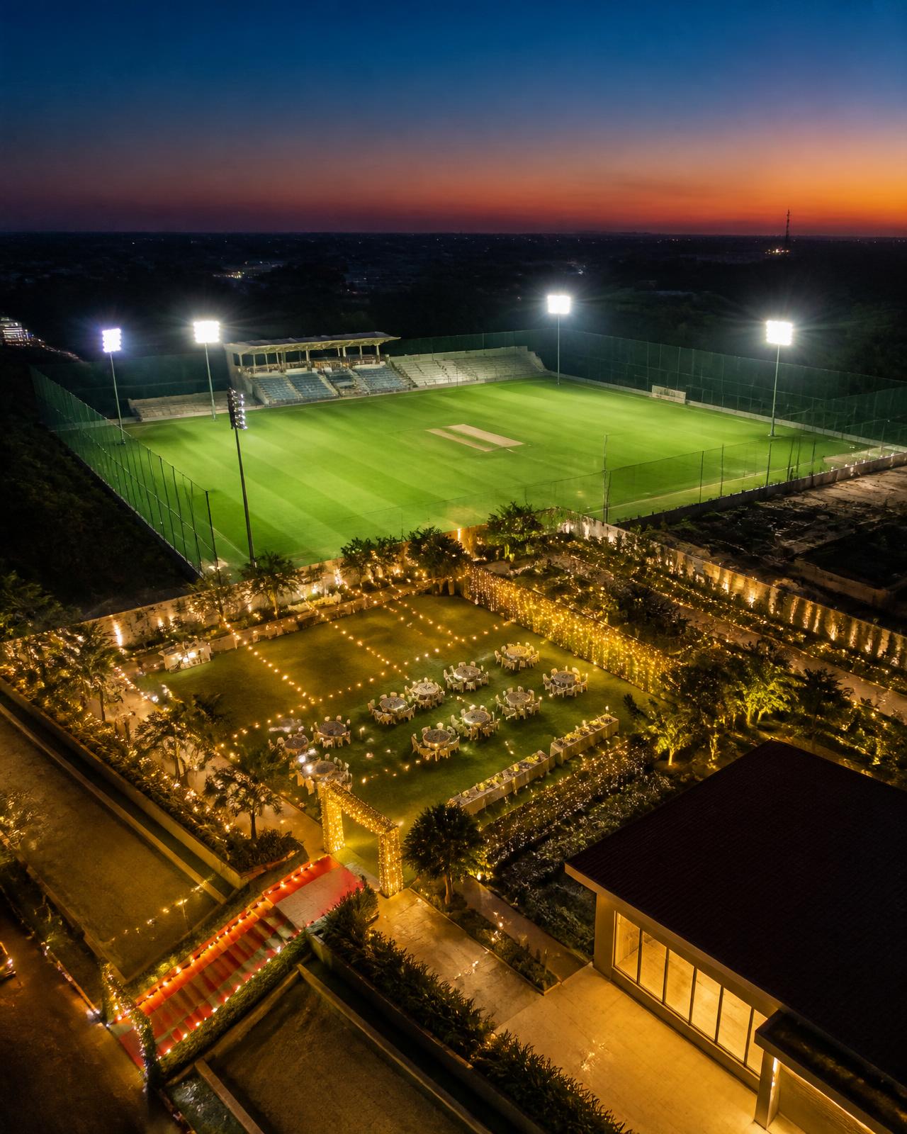Aerial view of Jilani's GT Grounds sports turf and event garden at dusk